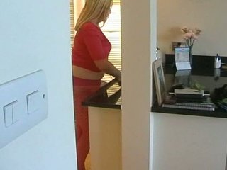 busty blond hose wife in her kitchen fingers her